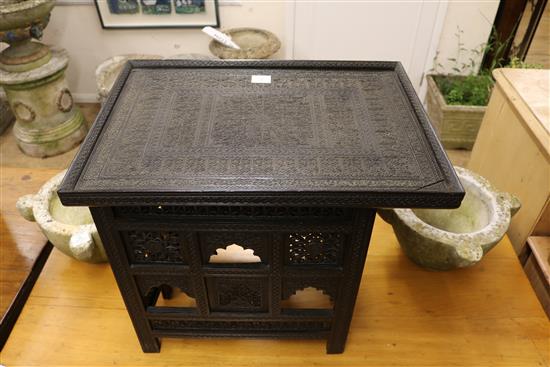 A Nagina ebony table W.61cm